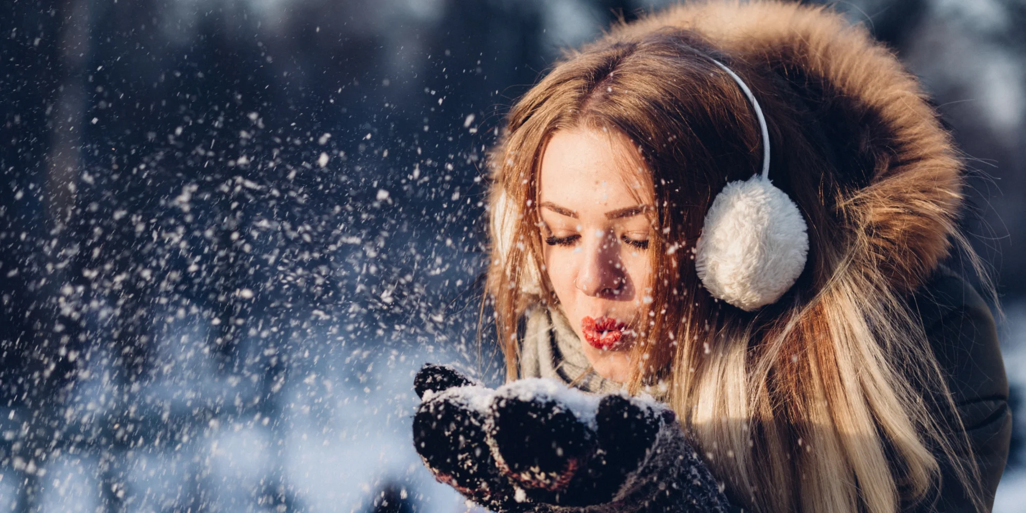 Woman enjoying herself in the winter snow