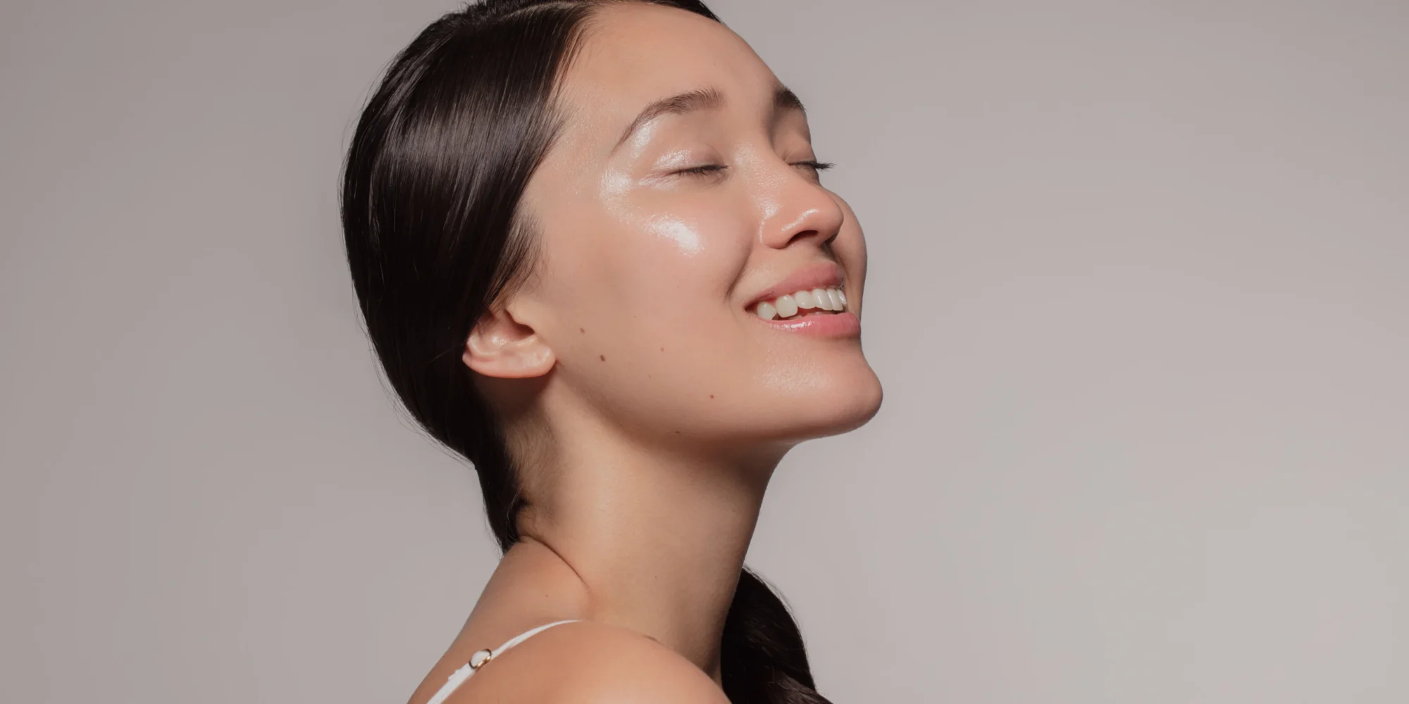 Woman smiling after applying retinol