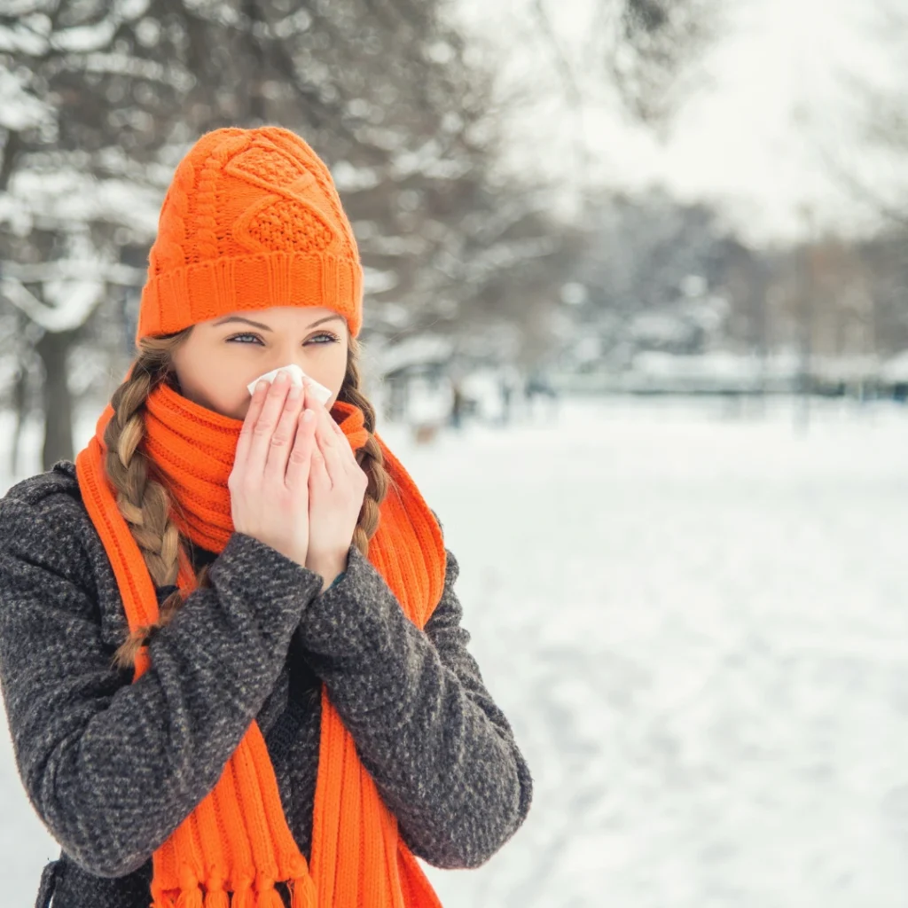 Woman outside in the winter struggling with dry skin due to the cold weather